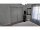 Bright bedroom featuring tiled floor, a closet, and a standing decorative shelf at 15106 Sw 38Th Cir, Ocala, FL 34473