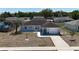 Aerial showcasing a well-kept single-story house with a garage and front yard at 15106 Sw 38Th Cir, Ocala, FL 34473