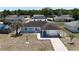 Aerial view of a single-story home highlighting its manicured lawn and attached garage at 15106 Sw 38Th Cir, Ocala, FL 34473