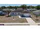 Front aerial view of a cozy residence, accentuating the driveway and attached garage at 15106 Sw 38Th Cir, Ocala, FL 34473