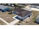 Aerial view of house with attached garage, manicured landscaping, and fenced backyard in a residential neighborhood at 15106 Sw 38Th Cir, Ocala, FL 34473