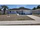 Charming single Gathering home featuring a one-car garage and well maintained lawn and landscaping at 15106 Sw 38Th Cir, Ocala, FL 34473