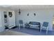 A cozy front porch with comfortable seating offers a welcoming entrance to the home at 15106 Sw 38Th Cir, Ocala, FL 34473