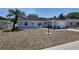 Charming single-story home with well-manicured front yard, palm tree, and covered porch at 15106 Sw 38Th Cir, Ocala, FL 34473