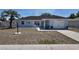 Charming single-story home with well-manicured front yard, palm tree, and covered porch at 15106 Sw 38Th Cir, Ocala, FL 34473