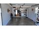 Spacious garage featuring laundry area with washer, dryer, and utility shelving for ample storage at 15106 Sw 38Th Cir, Ocala, FL 34473