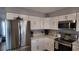 Bright kitchen with stainless steel refrigerator, oven, microwave, and ample counter space at 15106 Sw 38Th Cir, Ocala, FL 34473
