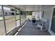 Inviting screened porch with comfortable seating, perfect for outdoor entertaining at 15106 Sw 38Th Cir, Ocala, FL 34473
