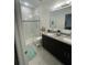 Modern bathroom with a tiled shower, a double vanity, and neutral finishes that look fantastic at 15954 Sw 55Th Avenue Rd, Ocala, FL 34473