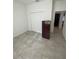Neutral bedroom with tile floors, a closet, and neutral colors that offer a calming space to relax at 15954 Sw 55Th Avenue Rd, Ocala, FL 34473