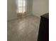 Neutral bedroom with tile floors, a closet, and neutral colors that offer a calming space to relax at 15954 Sw 55Th Avenue Rd, Ocala, FL 34473