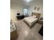Bright bedroom with a comfortable bed, a desk, and neutral decor with lots of space at 15954 Sw 55Th Avenue Rd, Ocala, FL 34473