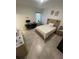 Bright bedroom with a comfortable bed, a desk, and neutral decor with lots of space at 15954 Sw 55Th Avenue Rd, Ocala, FL 34473