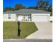 Charming single-story home with a well-manicured lawn, a two-car garage, and inviting curb appeal at 15954 Sw 55Th Avenue Rd, Ocala, FL 34473