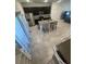 Open kitchen with stainless steel appliances, an island with bar seating, and granite countertops at 15954 Sw 55Th Avenue Rd, Ocala, FL 34473