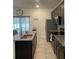 Well-equipped kitchen with stainless steel appliances, granite countertops, and ample cabinet space at 15954 Sw 55Th Avenue Rd, Ocala, FL 34473