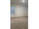 Bedroom with neutral carpet, one window with blinds, white walls, and simple white trim at 167 Eagleview Loop, Davenport, FL 33837