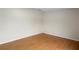 An empty bedroom with hardwood floors and blank walls, offers a clean canvas to create your ideal retreat at 18806 Monroe Ave, Orlando, FL 32820
