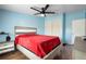Comfortable bedroom with ceiling fan, a spacious closet, and plenty of natural light at 18806 Monroe Ave, Orlando, FL 32820