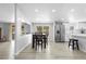 Open layout with the kitchen in background with white cabinets, stainless appliances, and dining area at 18806 Monroe Ave, Orlando, FL 32820
