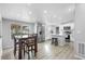 Kitchen and dining area, featuring stainless steel appliances, table with chairs, and modern lighting at 18806 Monroe Ave, Orlando, FL 32820
