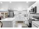 Bright kitchen featuring white cabinets, stainless steel appliances, counter tops, and backsplash at 18806 Monroe Ave, Orlando, FL 32820