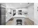 Modern kitchen with white cabinets, stainless steel appliances, an island, and sleek countertops at 18806 Monroe Ave, Orlando, FL 32820