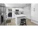Bright, modern kitchen featuring white cabinets, stainless steel appliances, and a stylish center island at 18806 Monroe Ave, Orlando, FL 32820