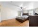 Main bedroom with natural light from two windows, ceiling fan, and hardwood floors at 18806 Monroe Ave, Orlando, FL 32820