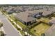 Aerial view of home with landscaped yard, patio and the surrounding neighborhood at 19283 Allium Pl, Orlando, FL 32827