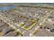 Beautiful aerial view highlighting property lines in a neighborhood near a lake at 19283 Allium Pl, Orlando, FL 32827