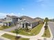 Aerial view of home with manicured lawn, landscaping and neighborhood at 19283 Allium Pl, Orlando, FL 32827