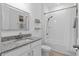 Bright bathroom featuring granite counters and shower-tub combo at 19283 Allium Pl, Orlando, FL 32827