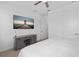 Bright bedroom featuring a large TV and modern grey dresser at 19283 Allium Pl, Orlando, FL 32827