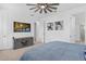 Comfortable bedroom with a television and ensuite bath at 19283 Allium Pl, Orlando, FL 32827