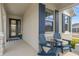 Welcoming front porch with Adirondack chairs and a view of the neighborhood at 19283 Allium Pl, Orlando, FL 32827