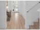 Bright hallway featuring stylish wood floors and white trim at 19283 Allium Pl, Orlando, FL 32827