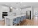 Spacious kitchen with a large island, stainless steel appliances, and modern finishes creating a chef's dream space at 19283 Allium Pl, Orlando, FL 32827
