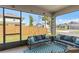 Relaxing screened-in lanai with comfortable seating and views of the fenced backyard at 19283 Allium Pl, Orlando, FL 32827