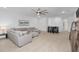 Expansive living area offering versatile seating options, media center and adjacent dining space at 19283 Allium Pl, Orlando, FL 32827