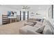Spacious living room with comfortable sectional sofa, media center, and plenty of natural light at 19283 Allium Pl, Orlando, FL 32827