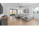 Cozy living room featuring a large sectional sofa and sliding glass doors to the patio at 19283 Allium Pl, Orlando, FL 32827