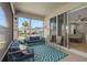 Charming screened-in patio with comfortable seating for enjoying the outdoors at 19283 Allium Pl, Orlando, FL 32827