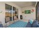 Inviting outdoor patio featuring comfortable seating, TV, and access via sliding glass doors at 19283 Allium Pl, Orlando, FL 32827
