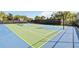 A versatile sports court with basketball hoop and tennis net, perfect for recreation and fitness within the community at 1995 Majorca Dr, Kissimmee, FL 34747