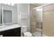 Bathroom featuring granite countertops, a walk-in shower, and modern fixtures at 1995 Majorca Dr, Kissimmee, FL 34747