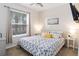 Cozy bedroom features a comfortable bed, soft lighting, and a bright window at 1995 Majorca Dr, Kissimmee, FL 34747