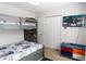 Bedroom with bunkbeds, television, and storage bench, ideal for children or guests at 1995 Majorca Dr, Kissimmee, FL 34747