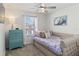 Comfortable bedroom with daybed, decorative dresser, and plenty of natural light at 1995 Majorca Dr, Kissimmee, FL 34747