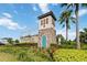 Windsor at Westside entrance sign nestled within lush tropical landscaping at 1995 Majorca Dr, Kissimmee, FL 34747